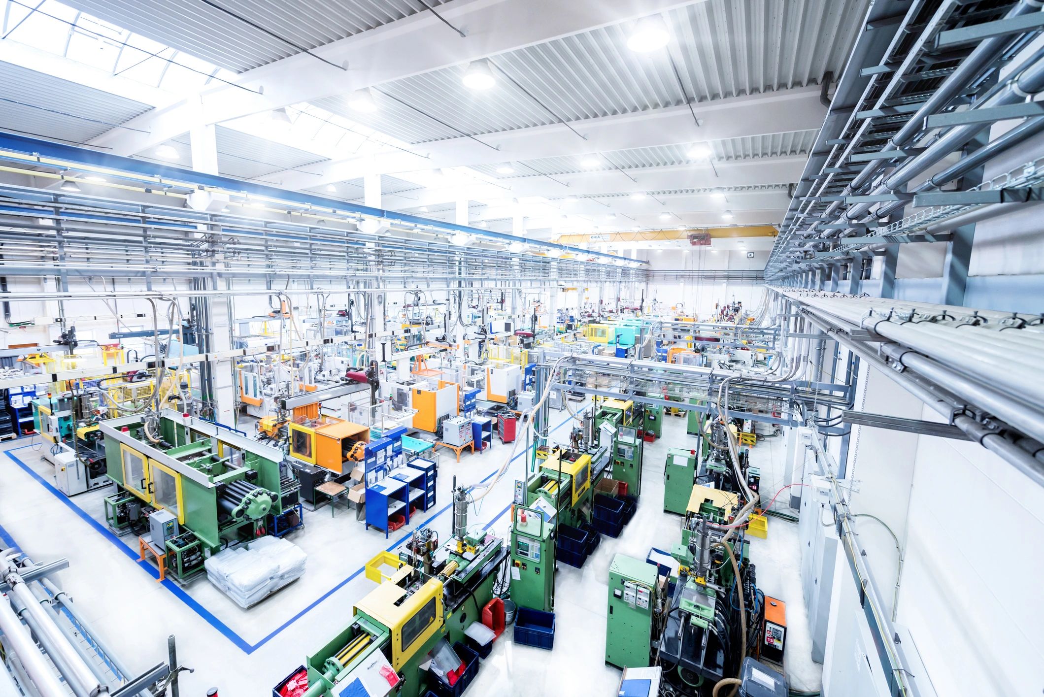 Heavy machinery operating in a modern factory setting.